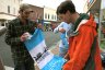 Volunteers hang banners to mark Cambridge's 325th anniversary year in 2009. 